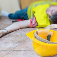 work accident man on the ground unconcious